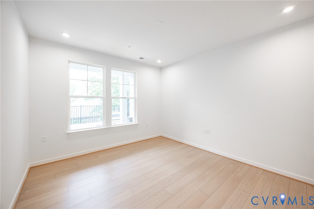 4005 Next Level Trace Midlothian, VA 23112 - Photo 11 of 28 an empty room with wooden floor and windows