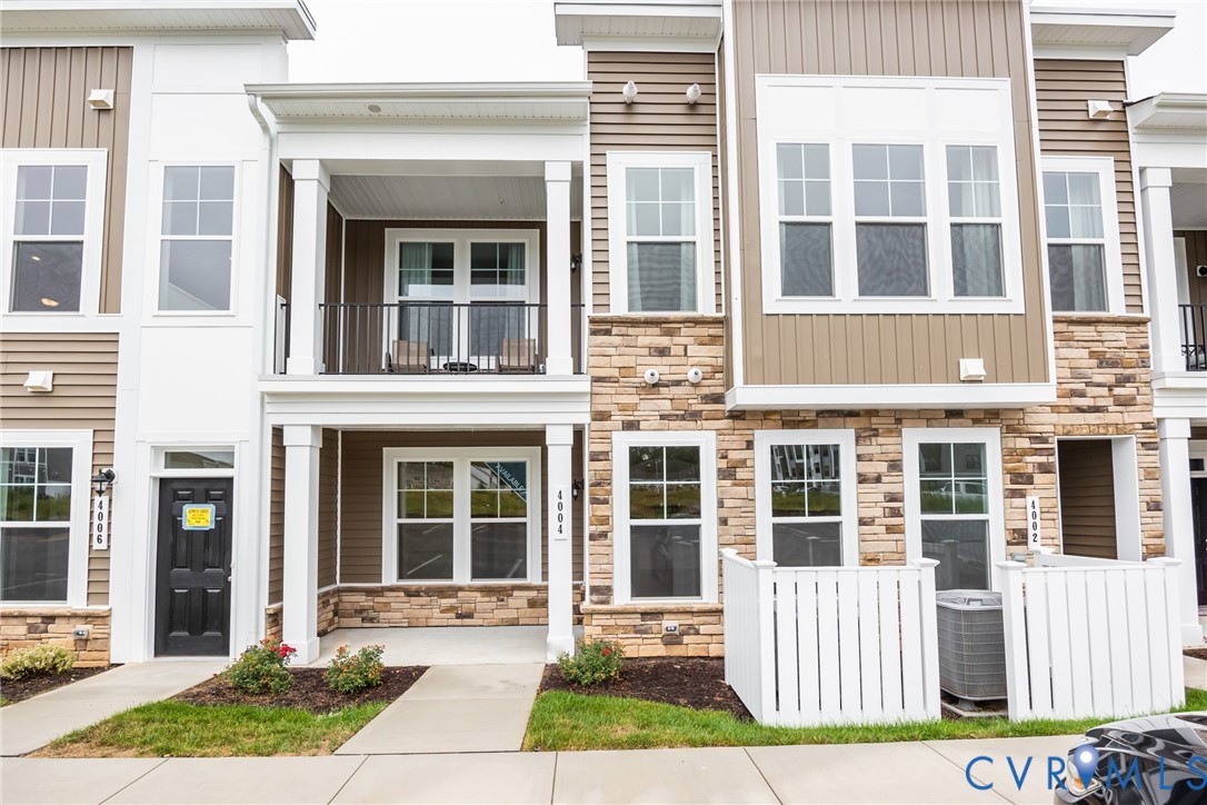4005 Next Level Trace Midlothian, VA 23112 - Photo 2 of 28 a front view of a house with a yard