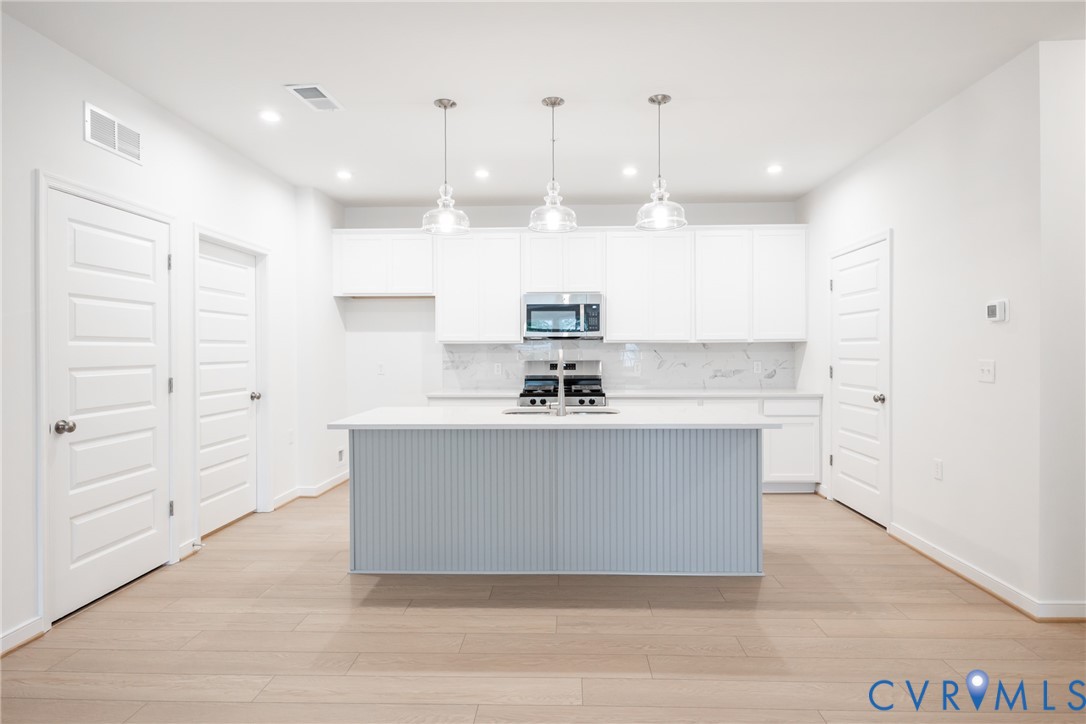 4005 Next Level Trace Midlothian, VA 23112 - Photo 7 of 28 a view living room with granite countertop furniture and a ceiling fan