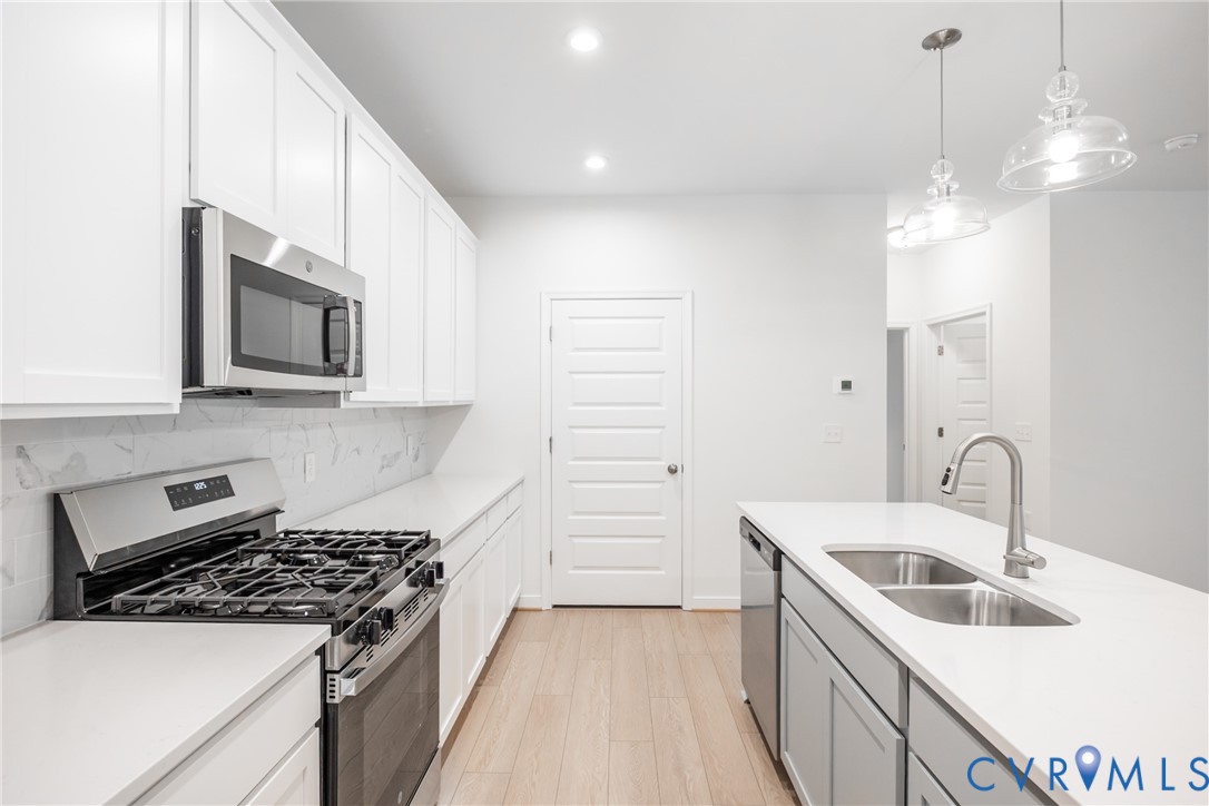 4005 Next Level Trace Midlothian, VA 23112 - Photo 8 of 28 a kitchen that has a sink and a stove top oven