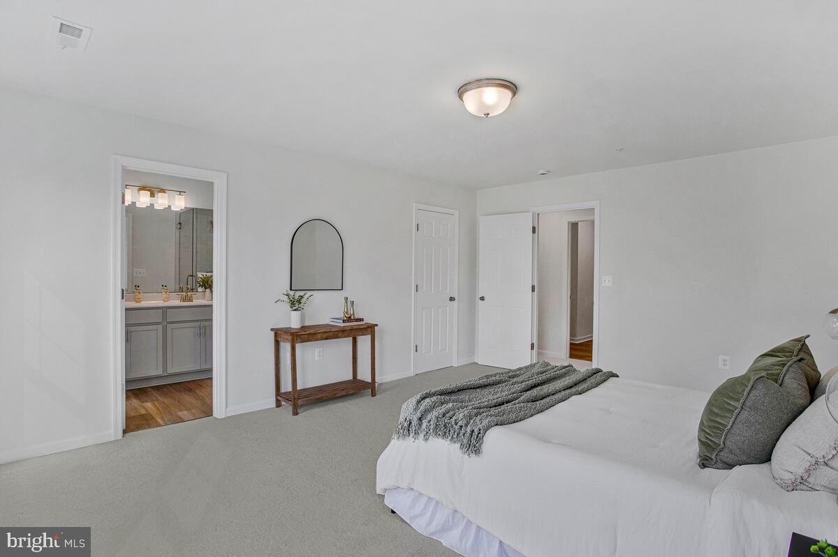 1225 Juniper Street Shady Side, MD 20764 - Photo 15 of 32 a bedroom with a bed and a dresser