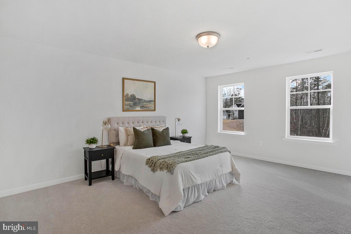 1225 Juniper Street Shady Side, MD 20764 - Photo 17 of 33 a bedroom with a bed and a window