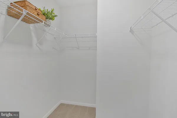 a bedroom with a bed and a lamp