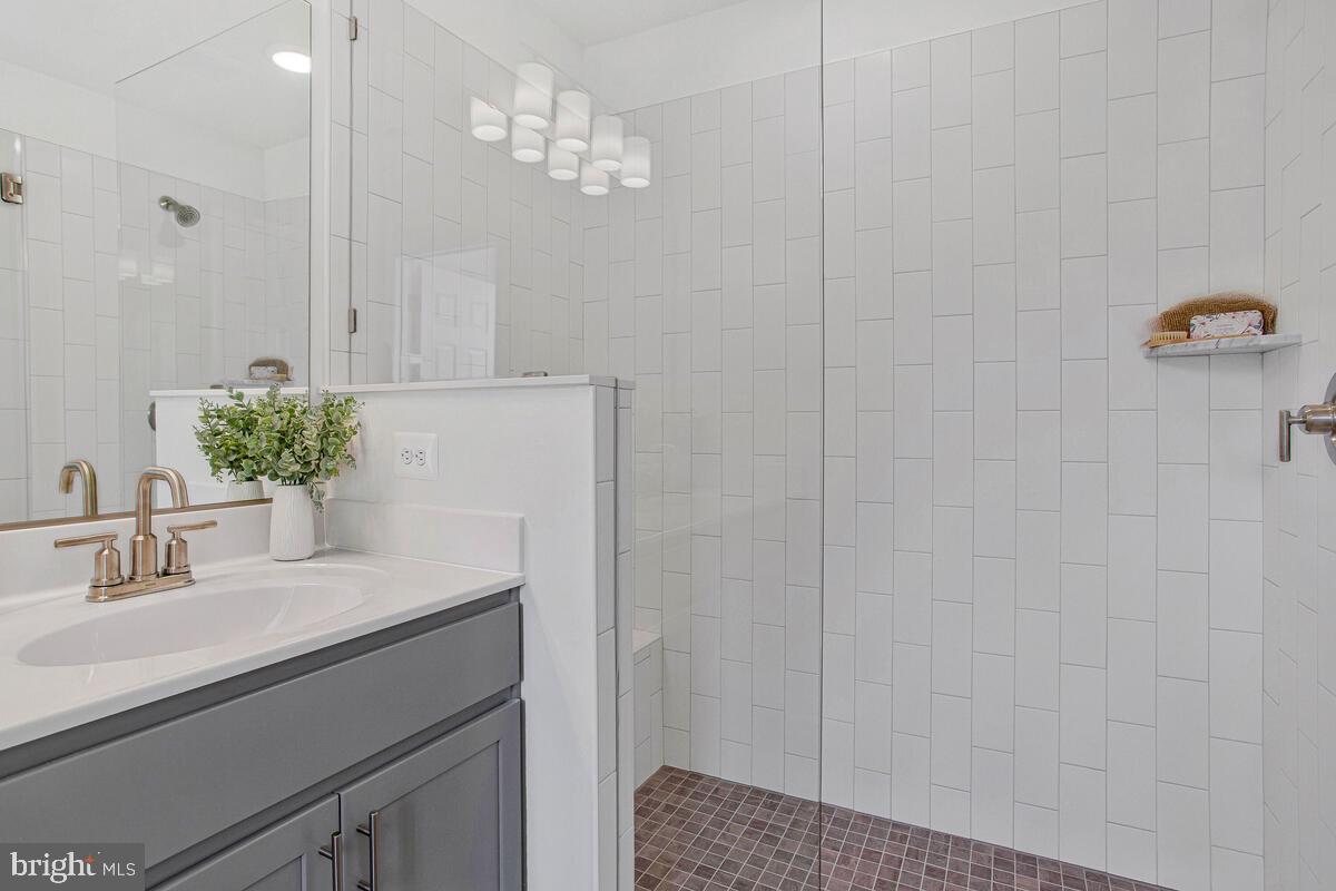 1225 Juniper Street Shady Side, MD 20764 - Photo 20 of 33 a bathroom with a sink and a mirror