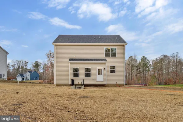 a house with trees in the background