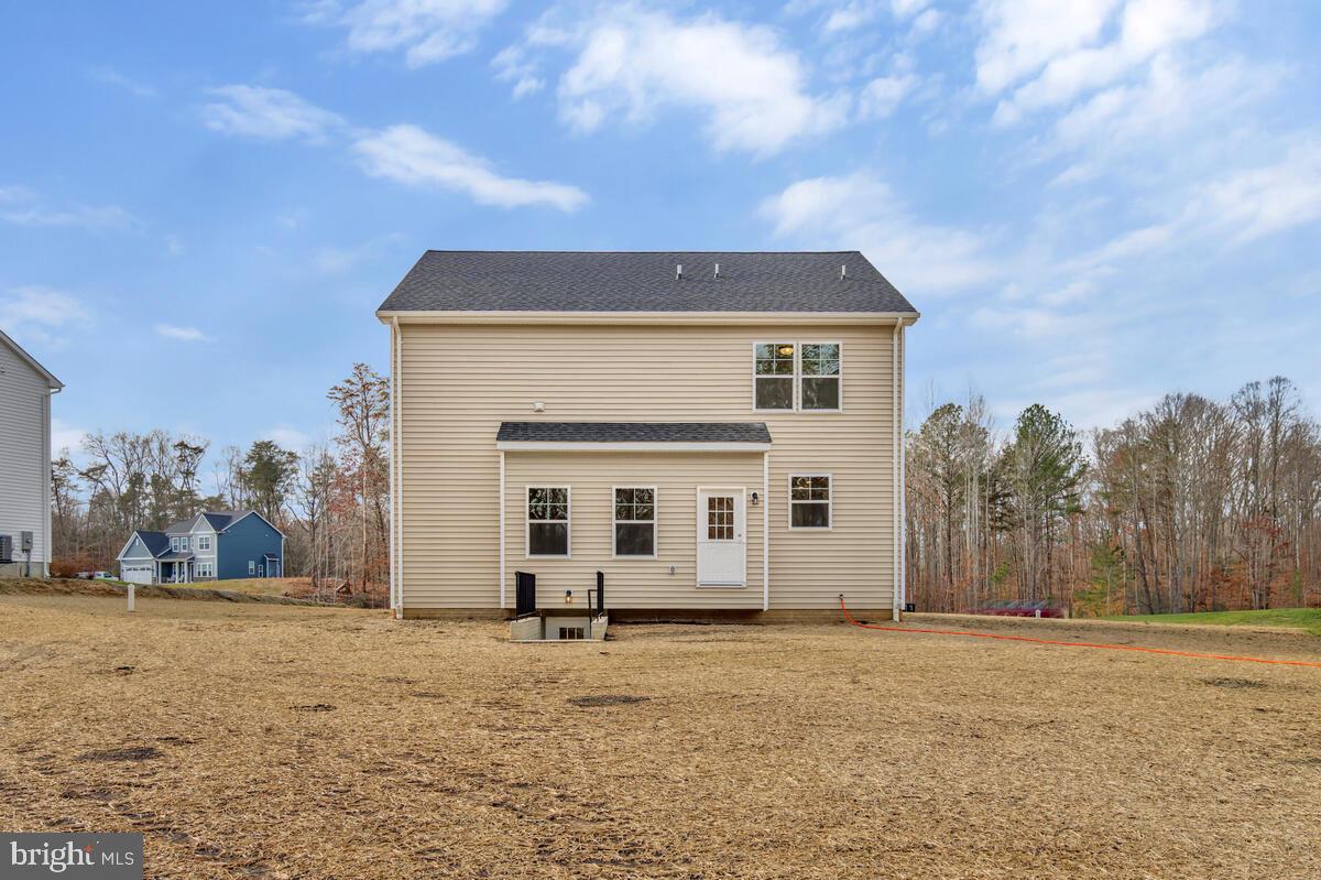 1225 Juniper Street Shady Side, MD 20764 - Photo 31 of 32 a house with trees in the background