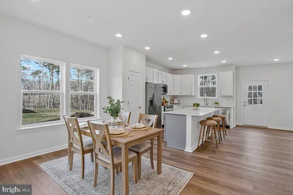 a view of kitchen island a sink and living room