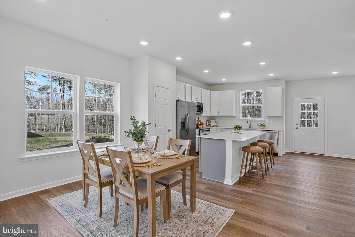 1225 Juniper Street Shady Side, MD 20764 - Photo 7 of 33 a view of a dining room with furniture window and wooden floor