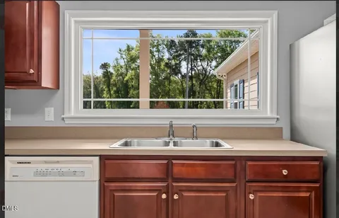 a sink sitting next to a window