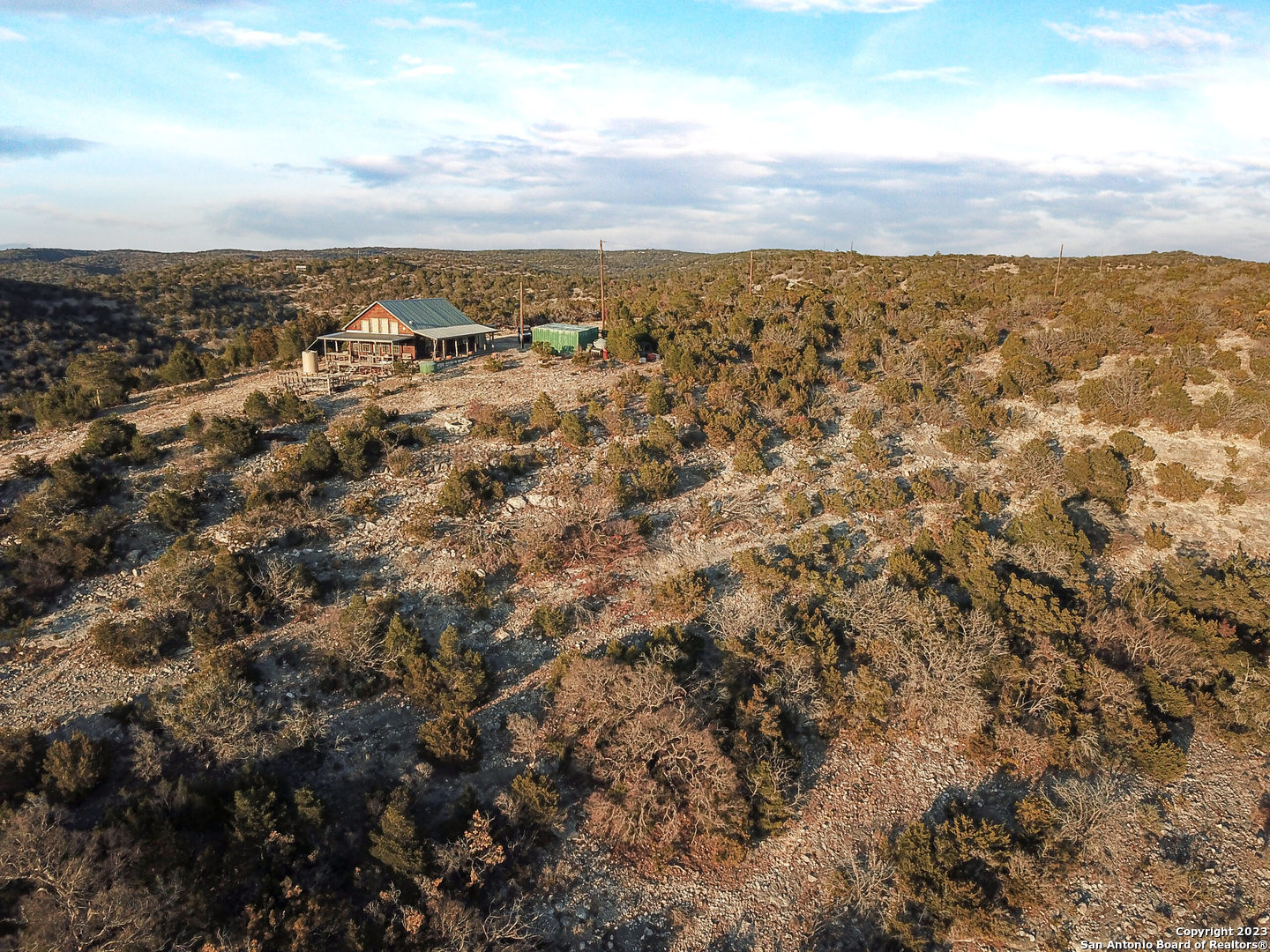 an aerial view of houses with city