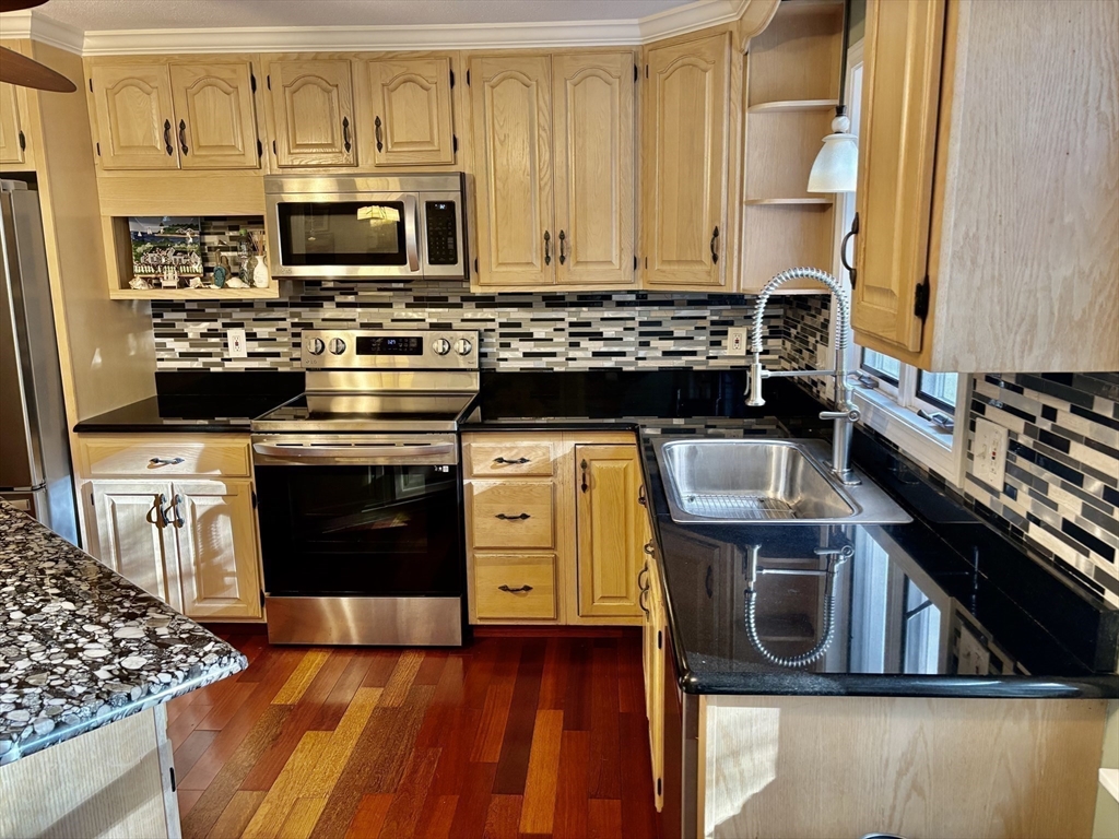 43 Wishing Well Way West Springfield, MA 01089 - Photo 13 of 42 a kitchen with a stove and a microwave