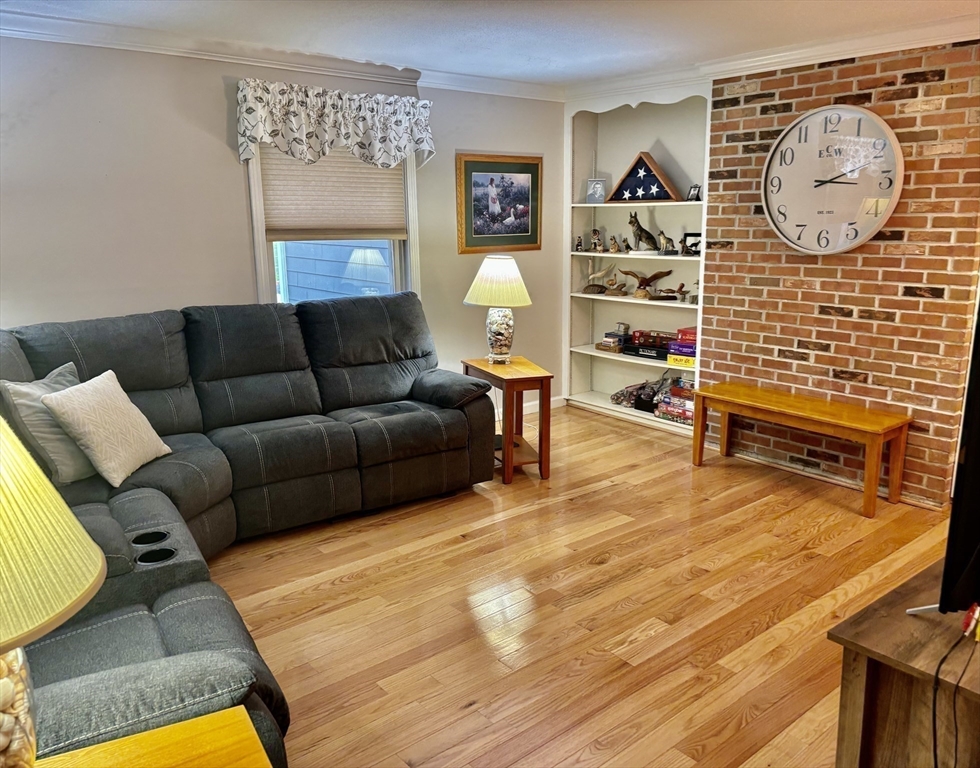 43 Wishing Well Way West Springfield, MA 01089 - Photo 19 of 42 a living room with furniture a wall paintings and a lamp