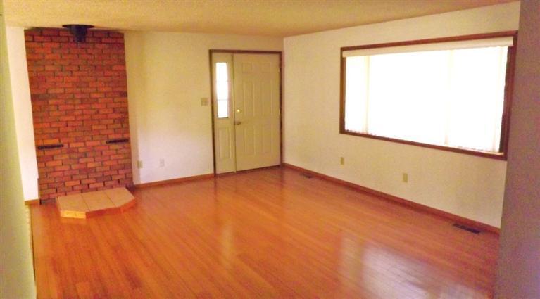 725 South Valley View Road Ashland, OR 97520 - Photo 3 of 18 a view of an empty room with wooden floor and a window