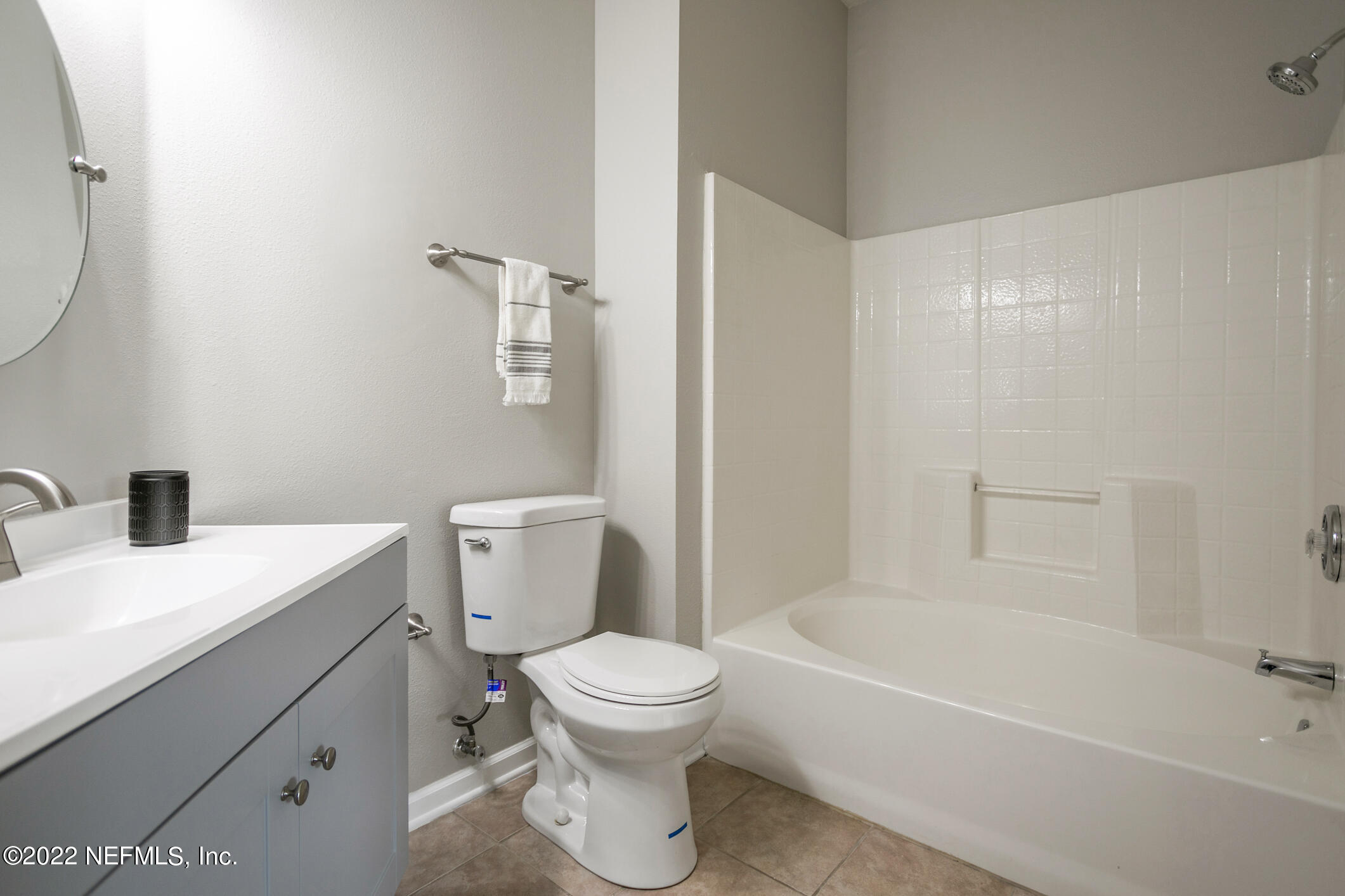 7990 Baymeadows Road, Unit 303 Jacksonville, FL 32256 - Photo 12 of 40 a bathroom with a sink a toilet and shower
