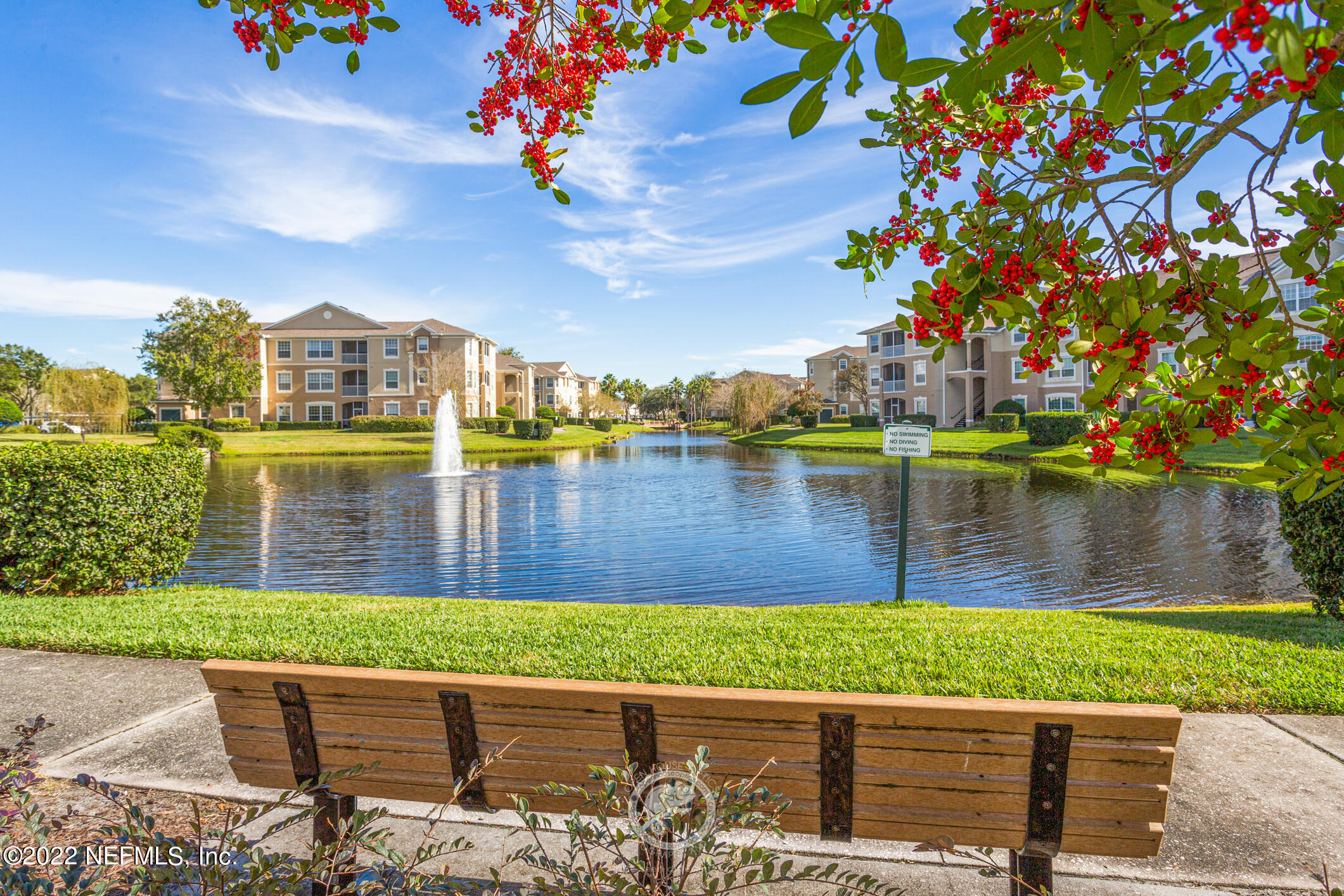 7990 Baymeadows Road, Unit 303 Jacksonville, FL 32256 - Photo 24 of 40 a view of a lake with a house in the background