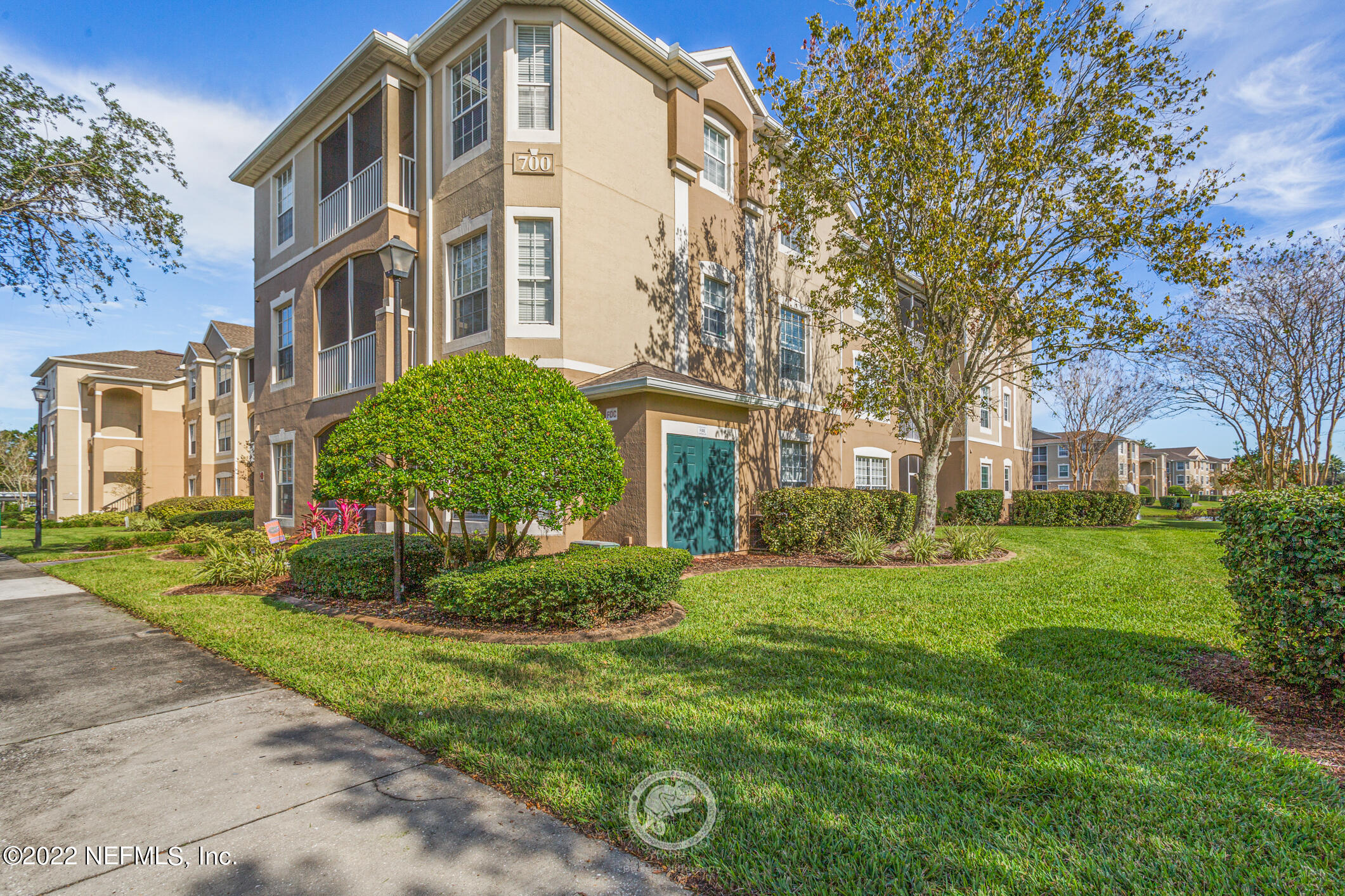 7990 Baymeadows Road, Unit 303 Jacksonville, FL 32256 - Photo 28 of 40 a view of a building with a yard