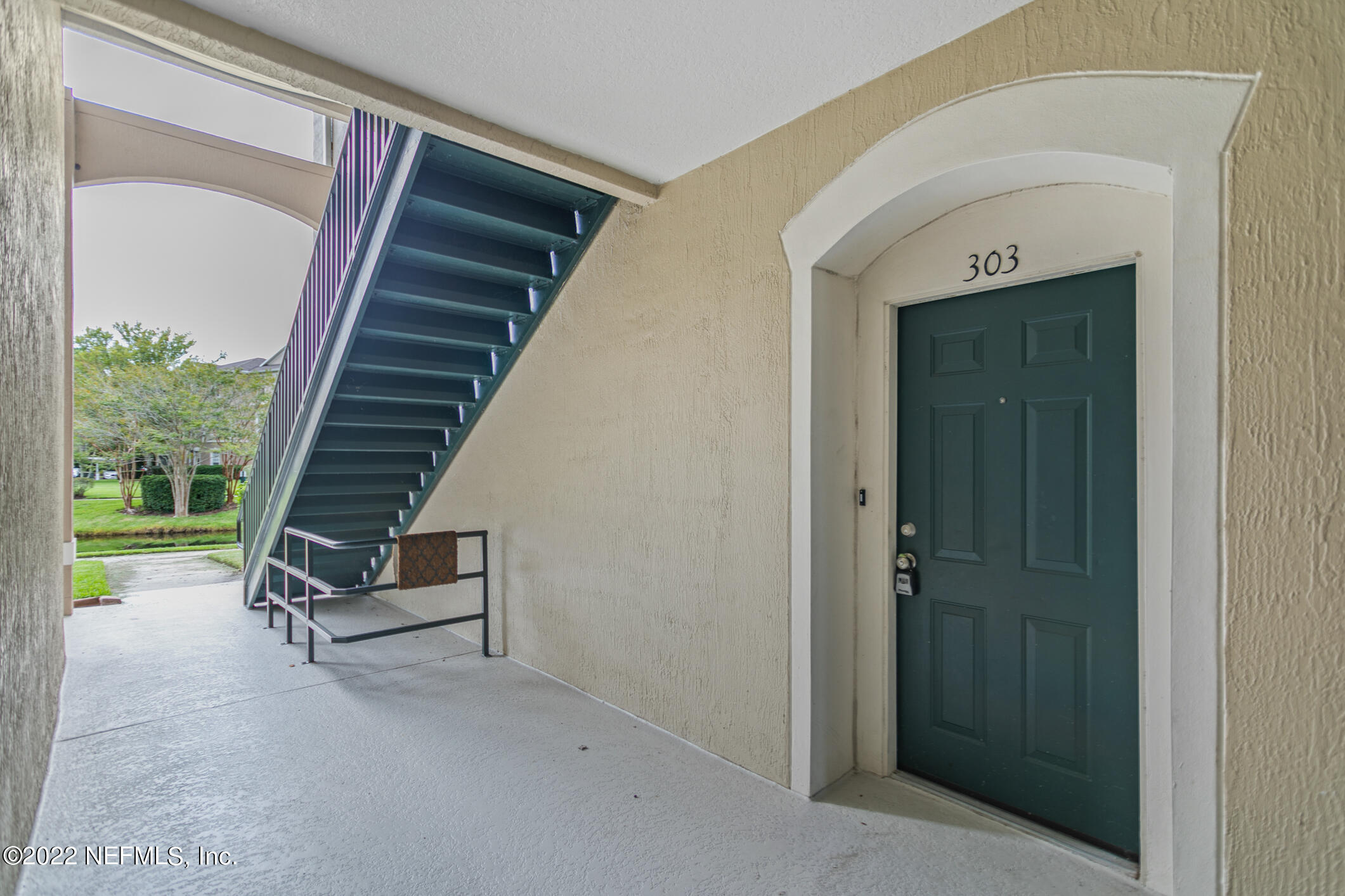 7990 Baymeadows Road, Unit 303 Jacksonville, FL 32256 - Photo 3 of 40 a view of a entryway door stairs and a living room