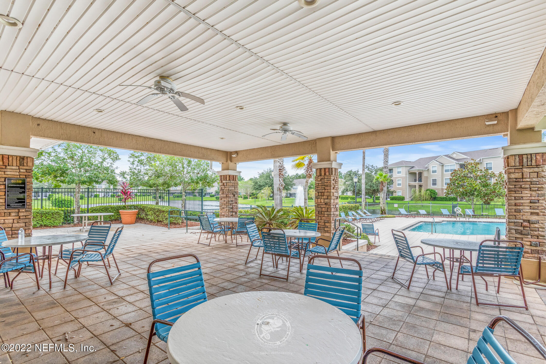 7990 Baymeadows Road, Unit 303 Jacksonville, FL 32256 - Photo 36 of 40 a view of a dining room with furniture wooden floor and garden view