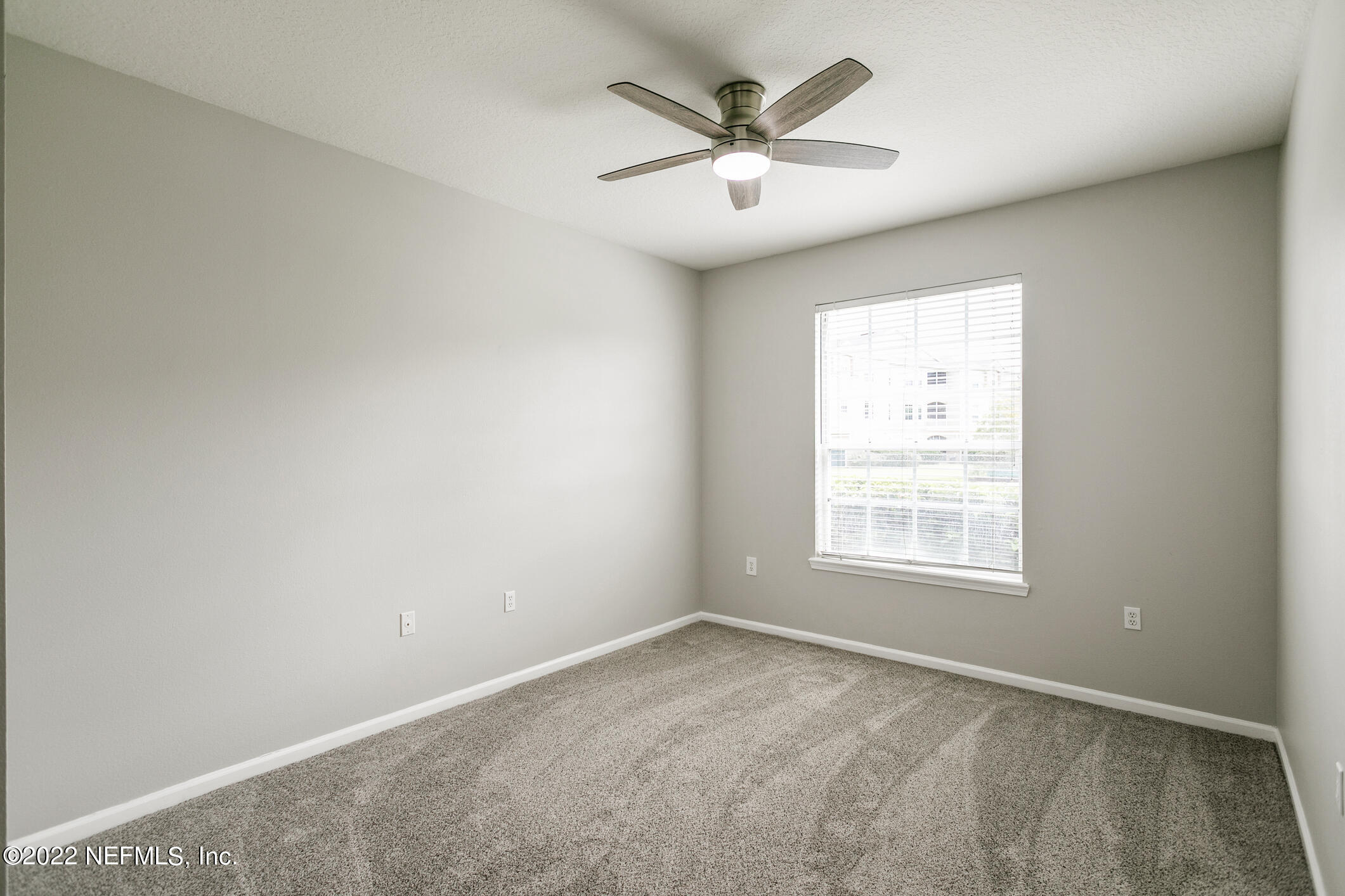 7990 Baymeadows Road, Unit 303 Jacksonville, FL 32256 - Photo 9 of 40 an empty room with a window