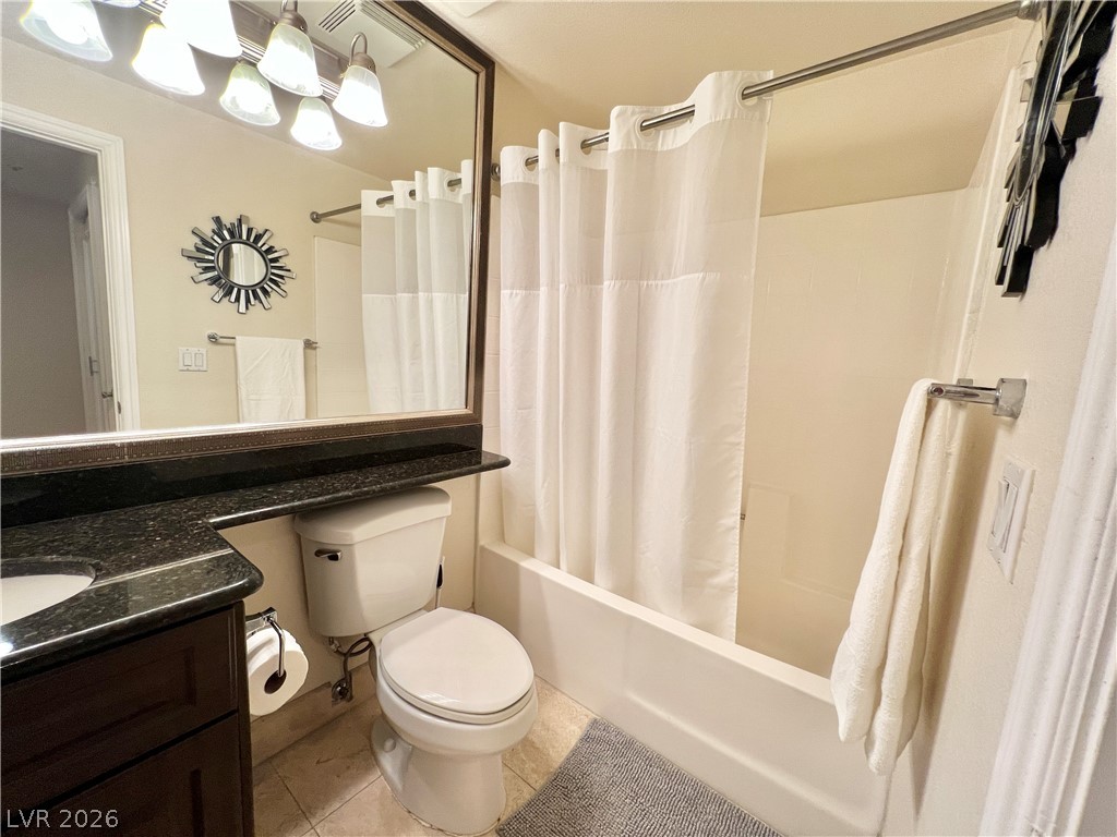 270 East Flamingo Road, Unit 313 Las Vegas, NV 89169 - Photo 17 of 27 Granite counters and a clean tub/shower combo complete this functional bathroom.