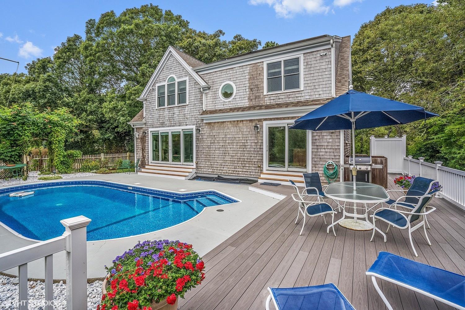 20 Lords Pond Road Chatham, MA 02650 - Photo 1 of 28 a view of a house with pool and chairs