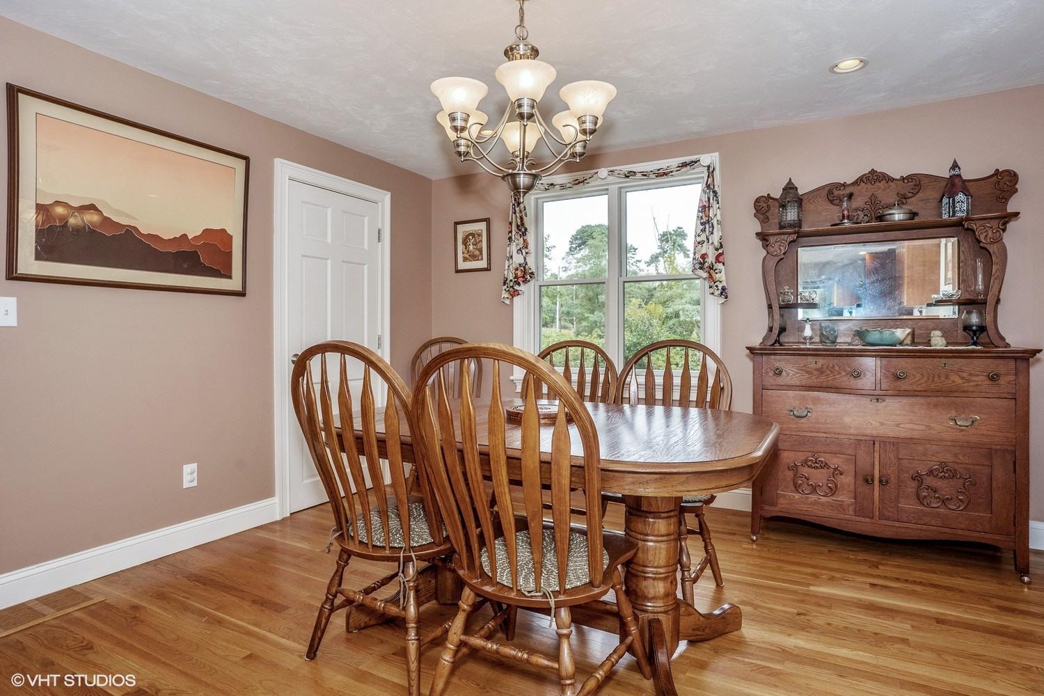 20 Lords Pond Road Chatham, MA 02650 - Photo 7 of 28 a view of a dining room with furniture wooden floor and chandelier