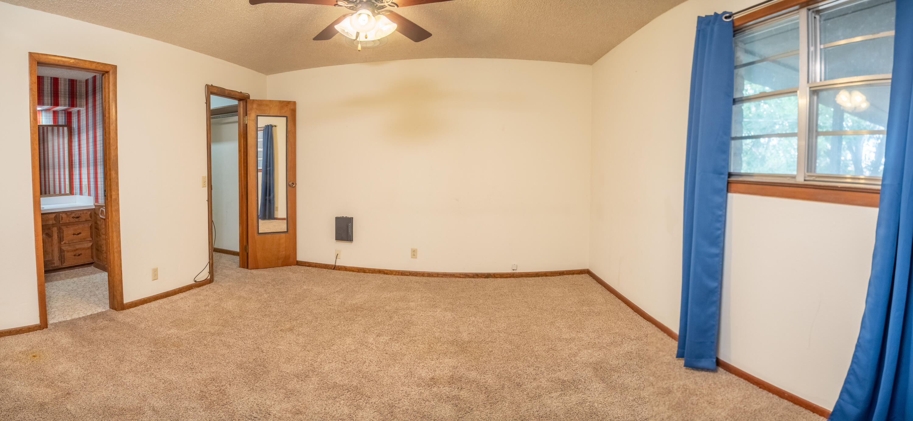 303 Comanche Trail Tulia, TX 79088 - Photo 22 of 37 a view of an empty room with a window