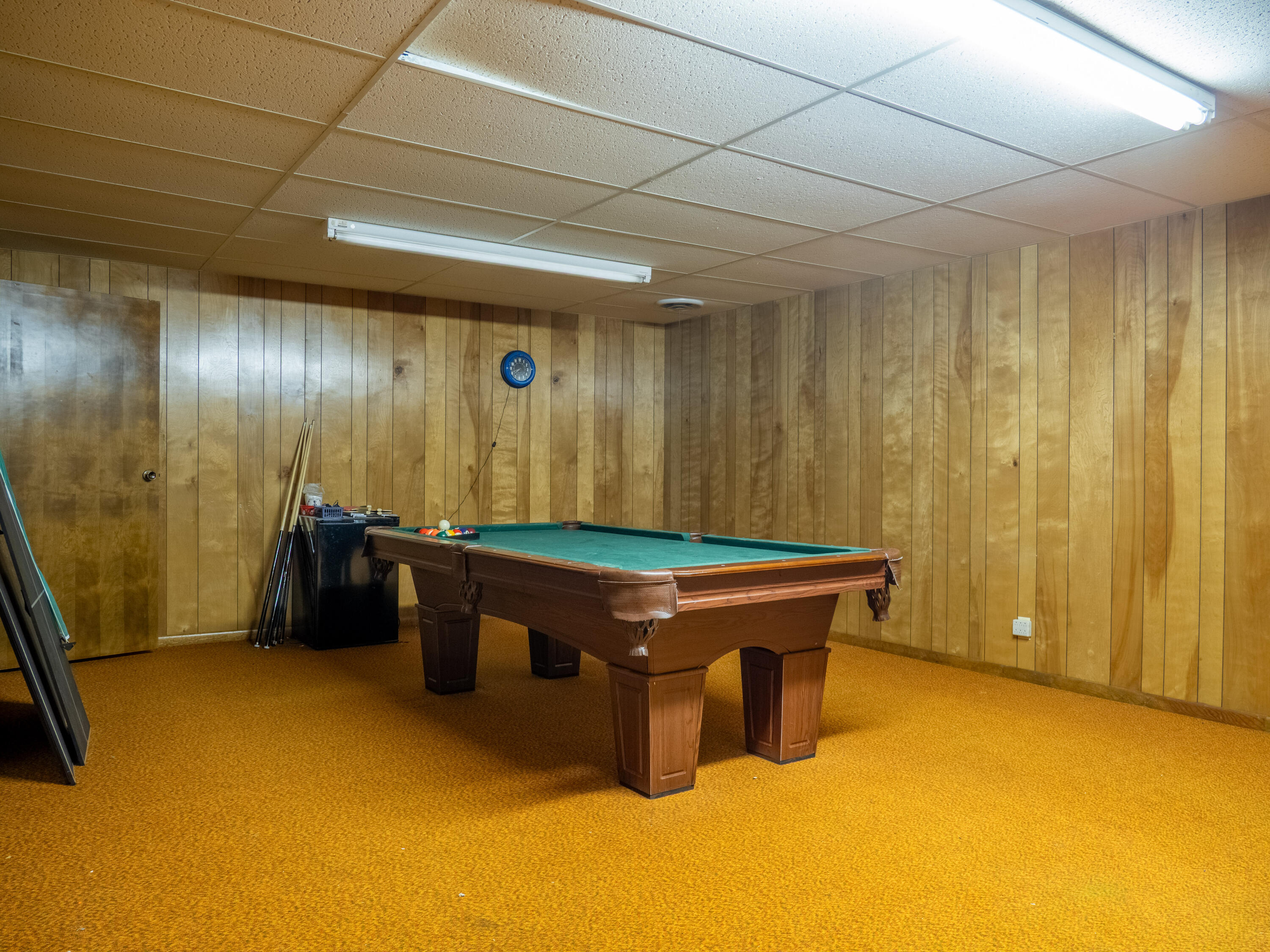 303 Comanche Trail Tulia, TX 79088 - Photo 32 of 37 a room with pool table and two windows
