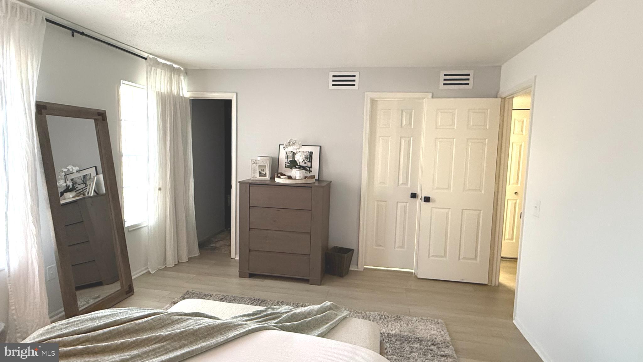 124 Fort Evans Road Southeast, Unit C Leesburg, VA 20175 - Photo 11 of 21 a view of a bedroom with closet area