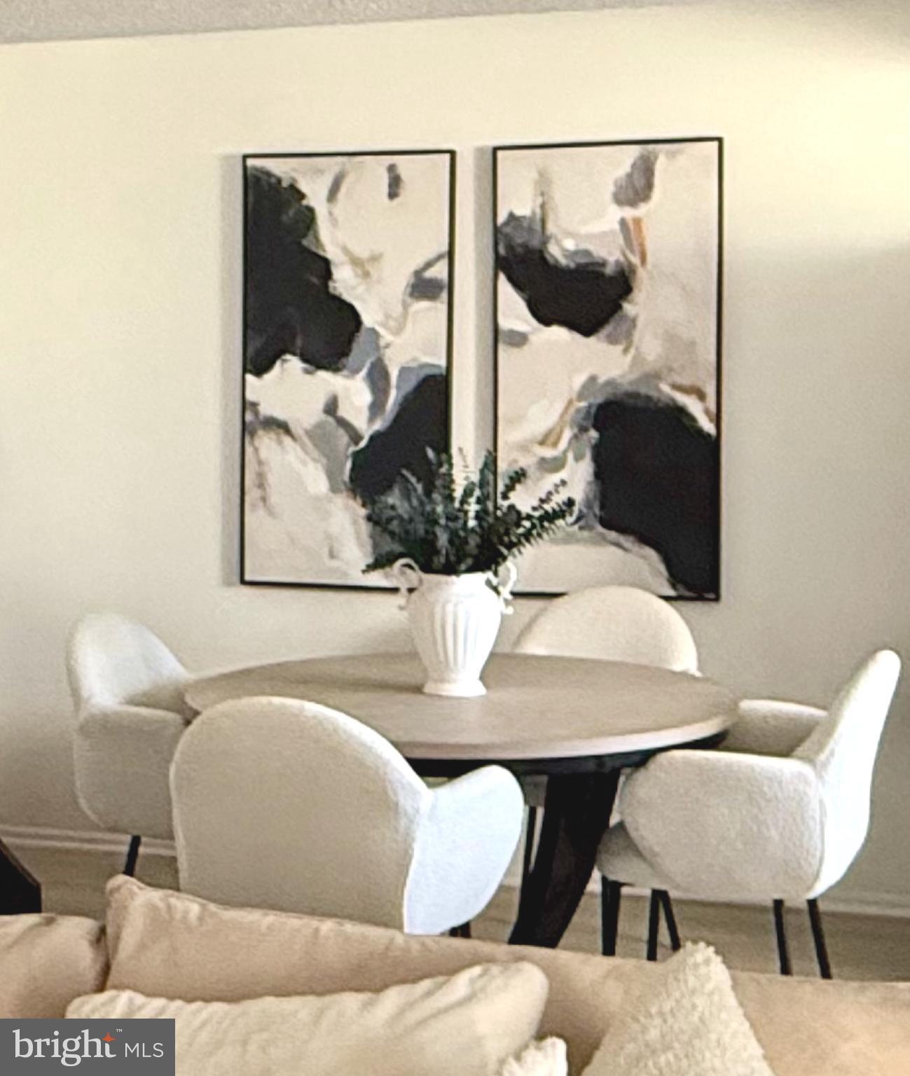 124 Fort Evans Road Southeast, Unit C Leesburg, VA 20175 - Photo 18 of 21 a view of a dining room with furniture and wooden floor