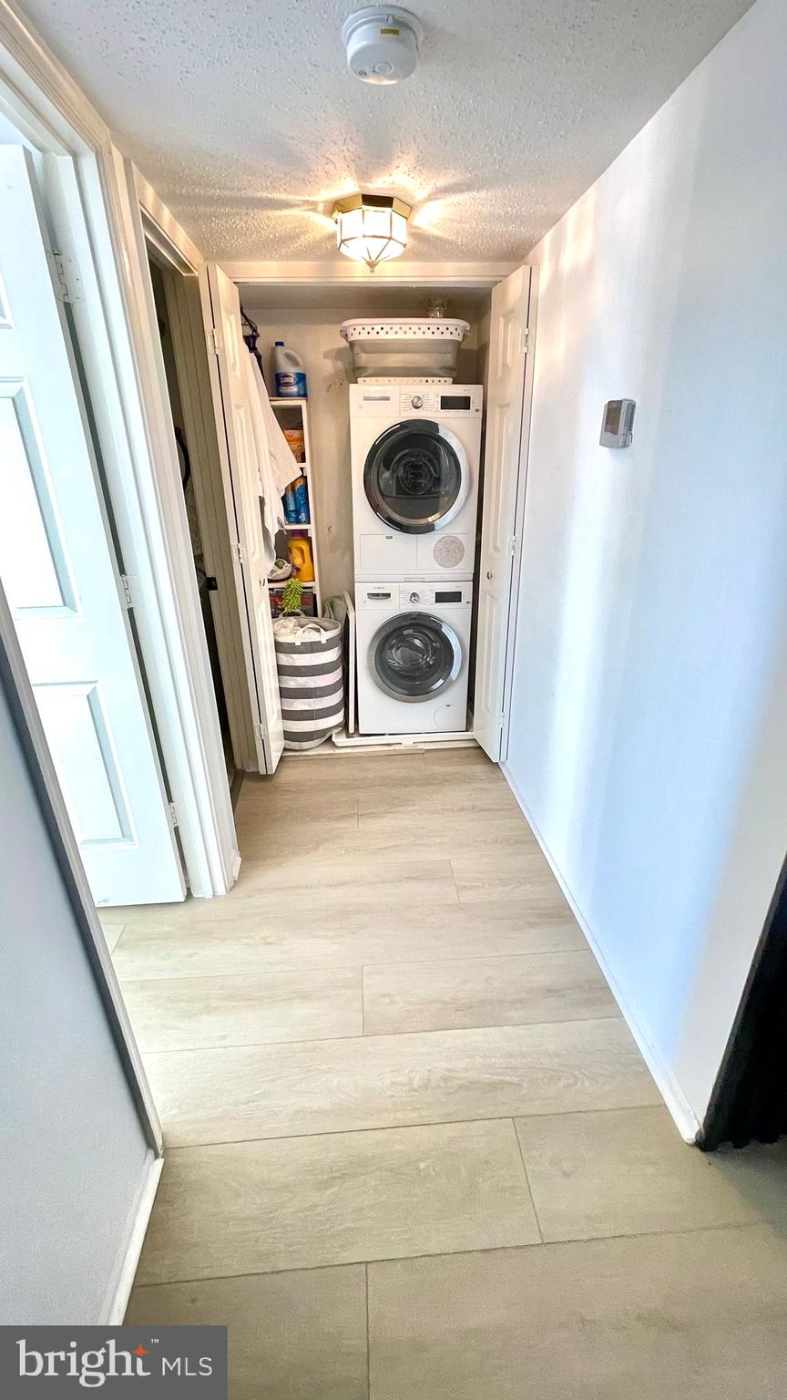 124 Fort Evans Road Southeast, Unit C Leesburg, VA 20175 - Photo 20 of 21 a view of a hallway with washer and dryer