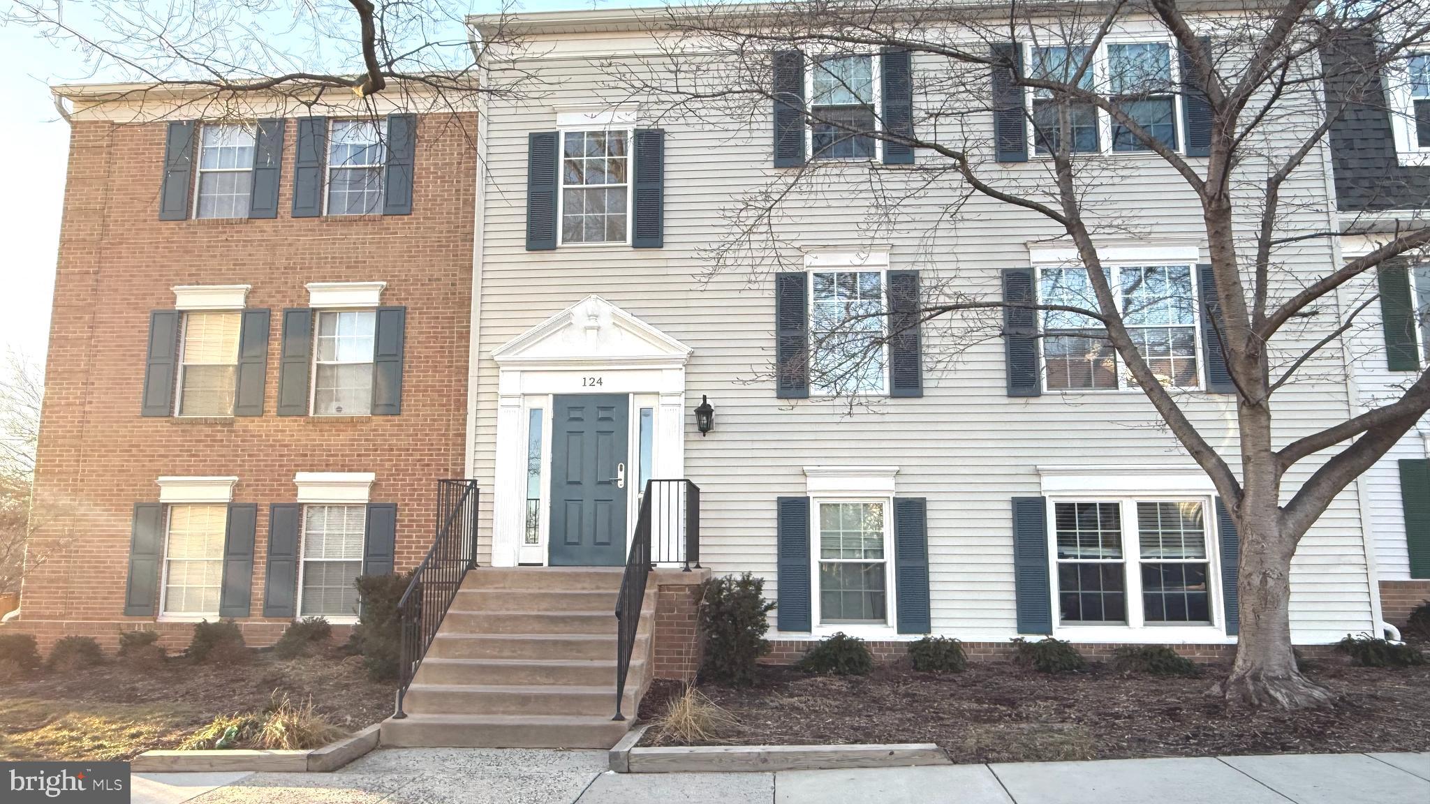124 Fort Evans Road Southeast, Unit C Leesburg, VA 20175 - Photo 21 of 21 a front view of a house with a yard