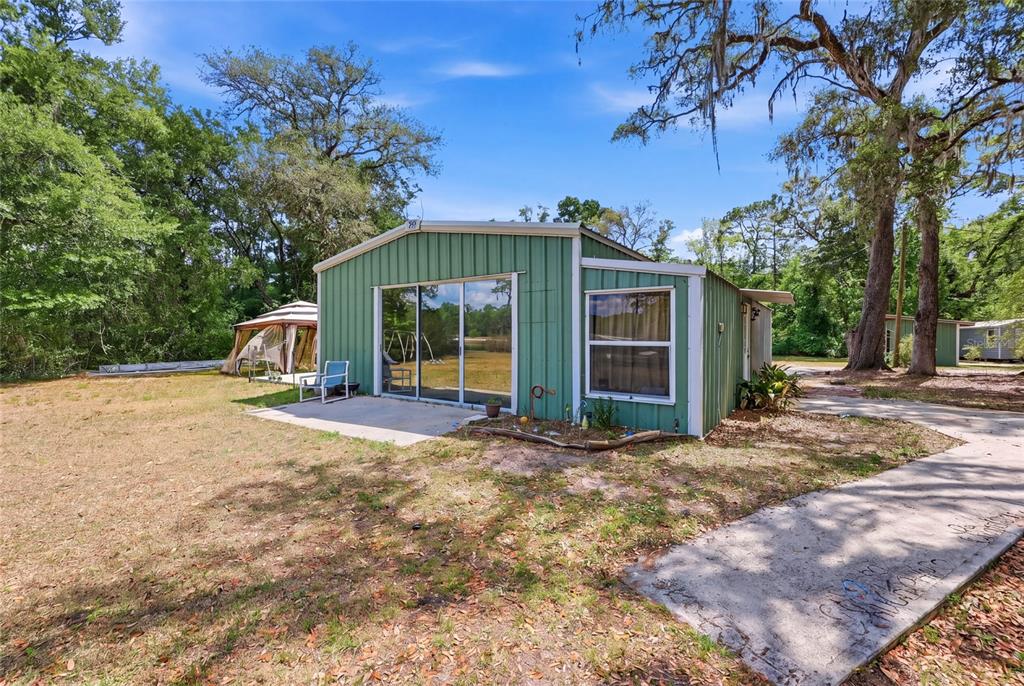 401 Southeast Falcon Road Branford, FL 32008 - Photo 67 of 76 a view of a house with a yard and large tree