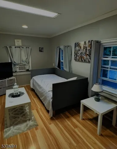 a bedroom with a bed and a table in it