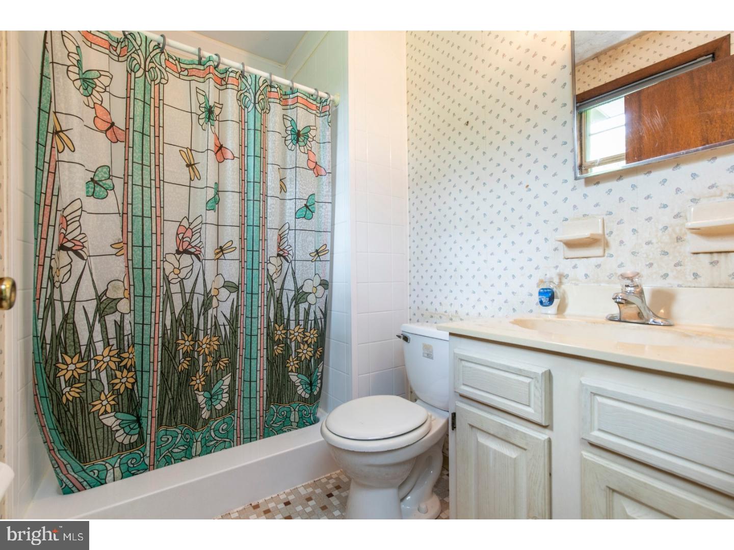108 Peacedale Road Landenberg, PA 19350 - Photo 12 of 25 a bathroom with a sink a toilet and shower curtain