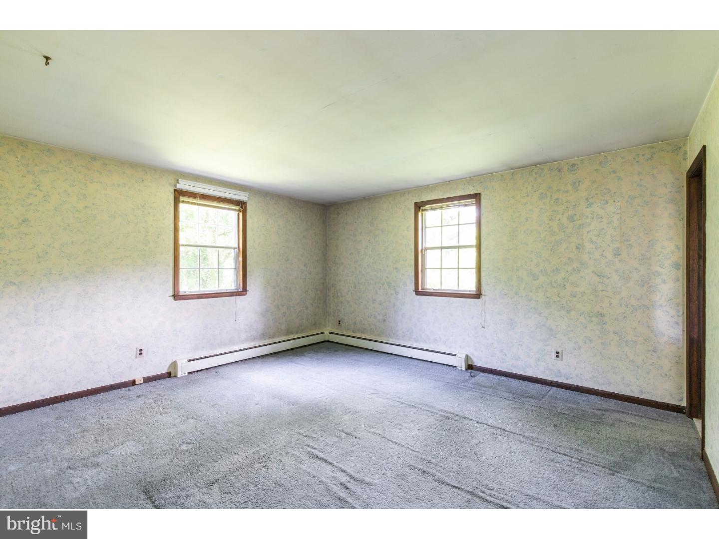 108 Peacedale Road Landenberg, PA 19350 - Photo 9 of 25 an empty room with windows