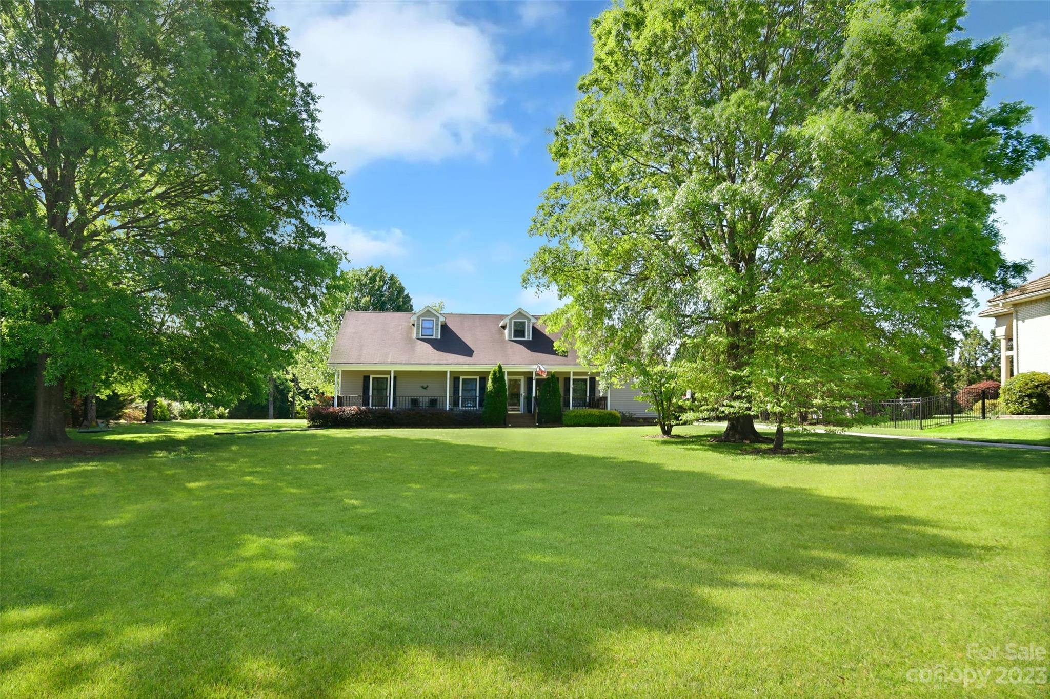 8017 Tottenham Drive Harrisburg, NC 28075 - Photo 2 of 36 a front view of a house with a yard