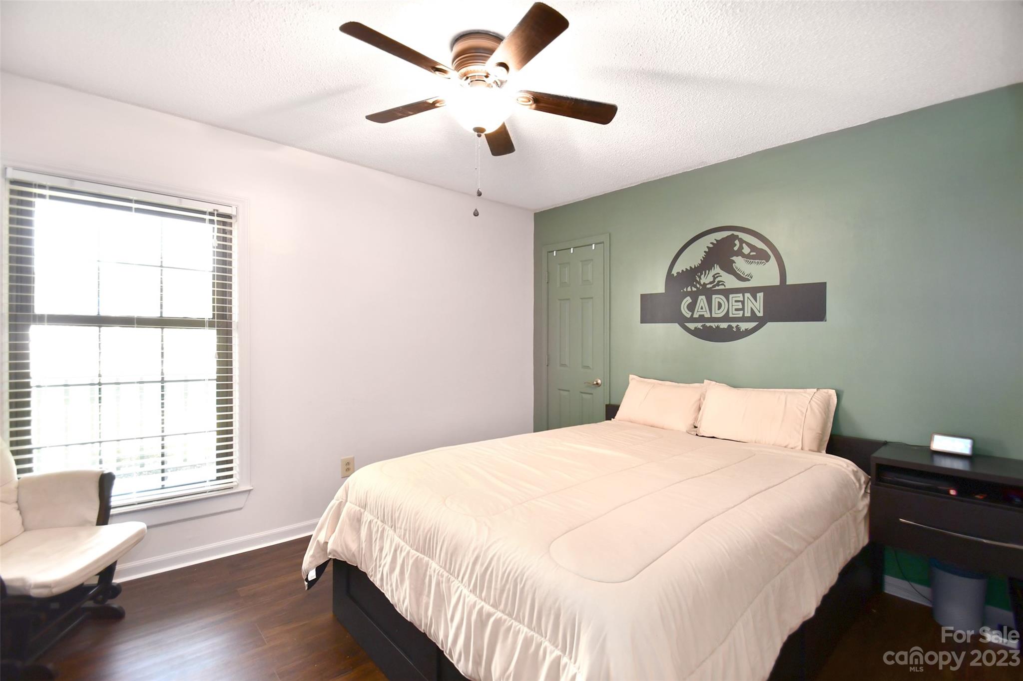 8017 Tottenham Drive Harrisburg, NC 28075 - Photo 21 of 36 a bedroom with a large bed and a window