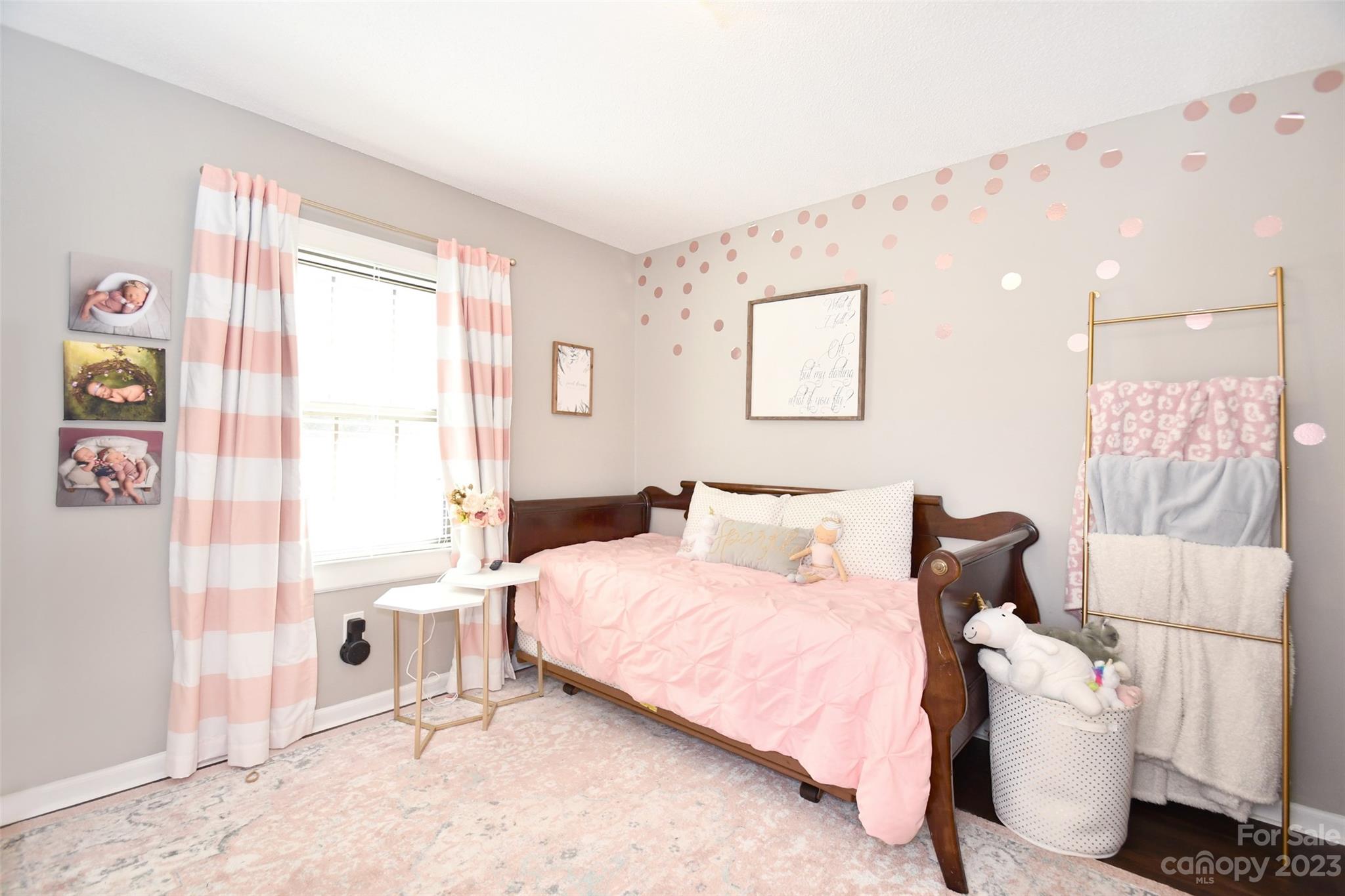 8017 Tottenham Drive Harrisburg, NC 28075 - Photo 22 of 36 a bedroom with a bed and a window