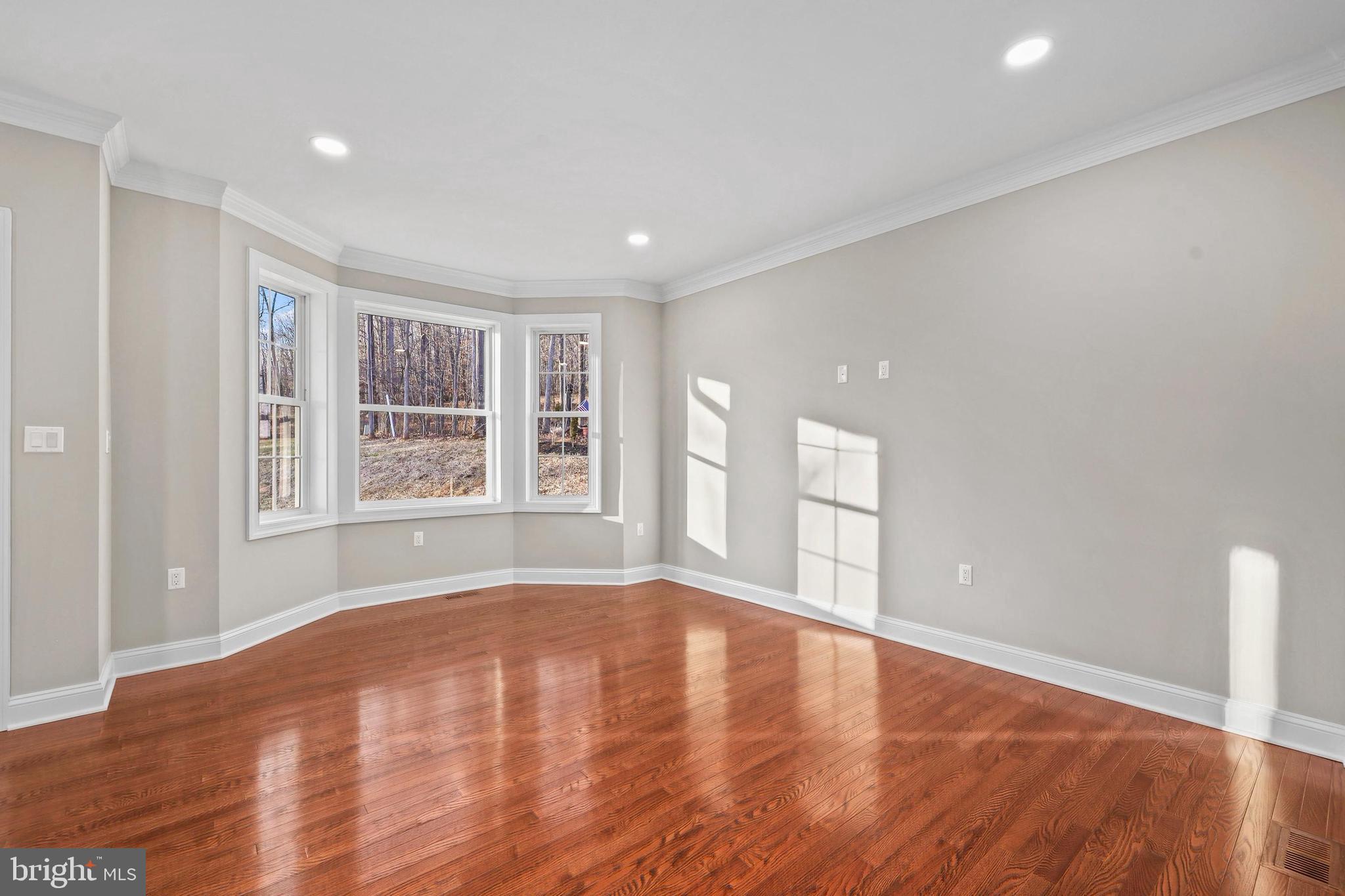 5393 Merry Oaks Road The Plains, VA 20198 - Photo 12 of 58 a view of an empty room with wooden floor and a window