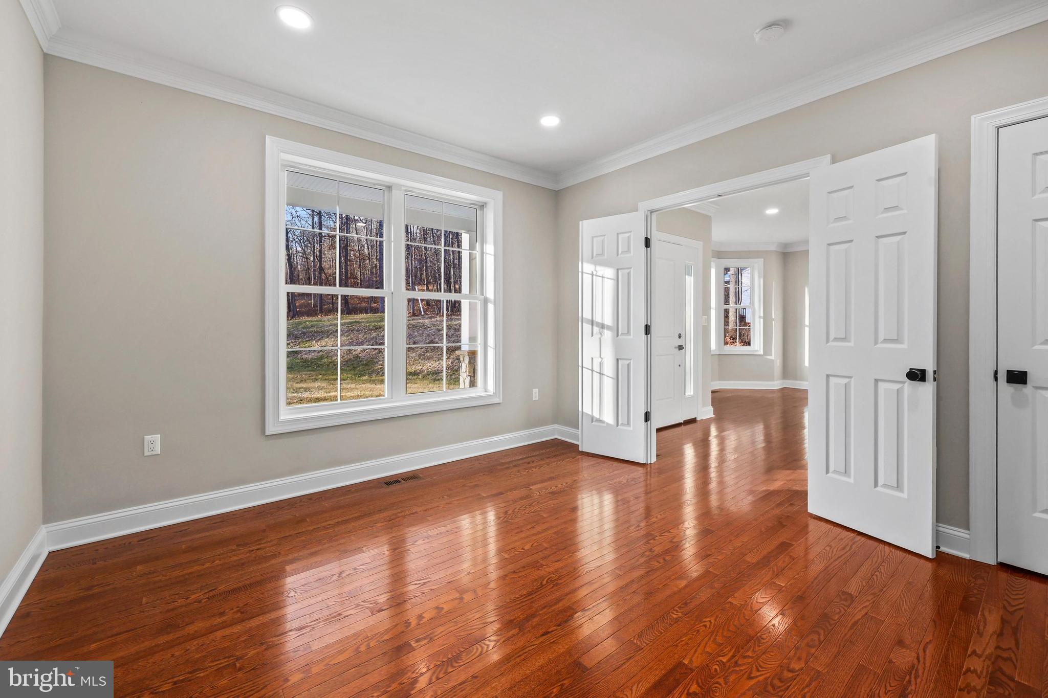 5393 Merry Oaks Road The Plains, VA 20198 - Photo 15 of 58 a view of empty room with wooden floor and windows