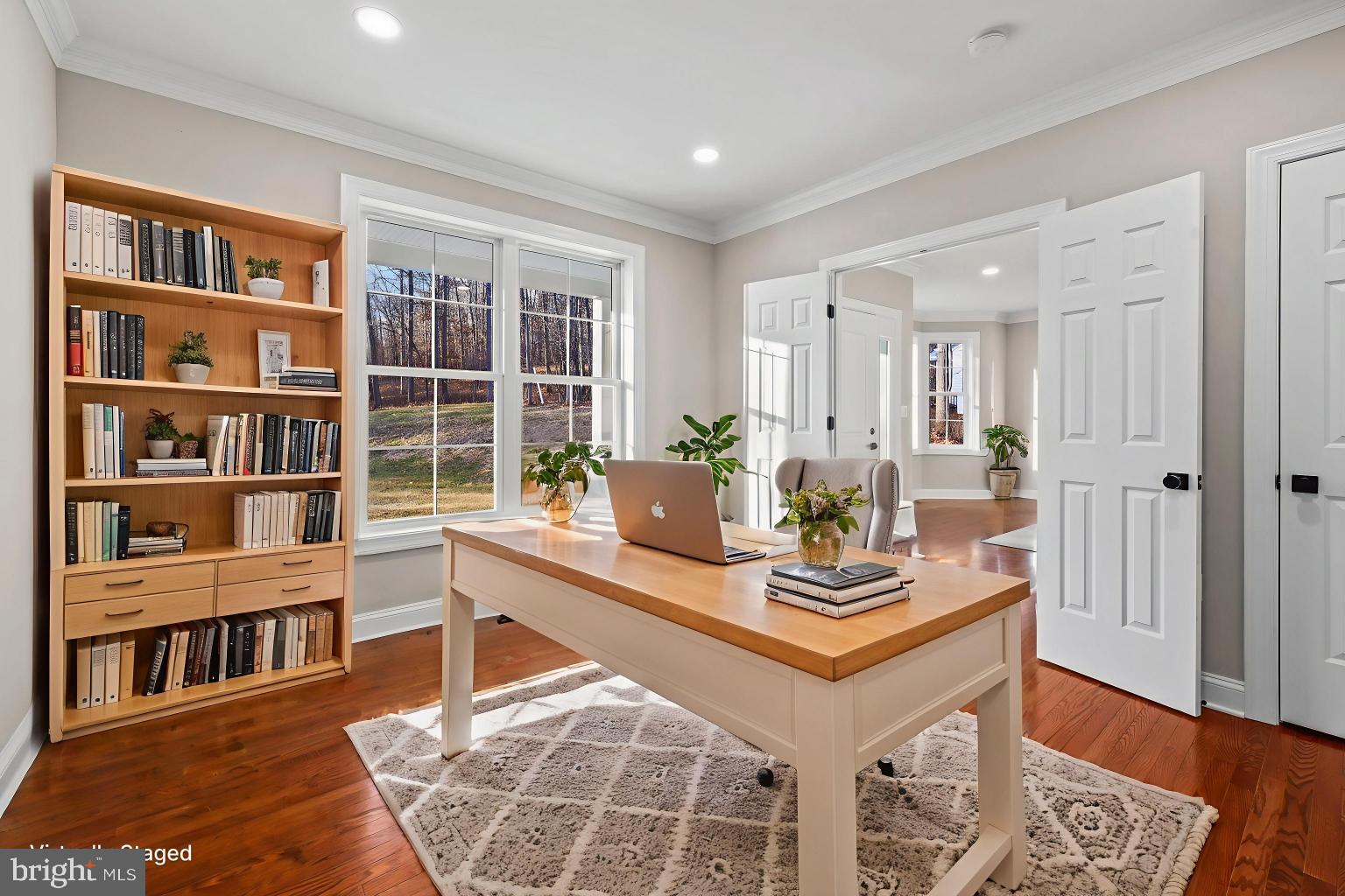 5393 Merry Oaks Road The Plains, VA 20198 - Photo 16 of 58 a view of a workspace with furniture and a book shelf