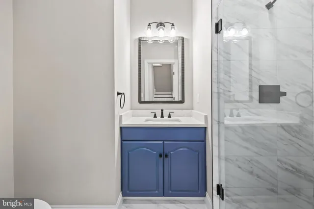 a living room with furniture wooden floor and a flat screen tv