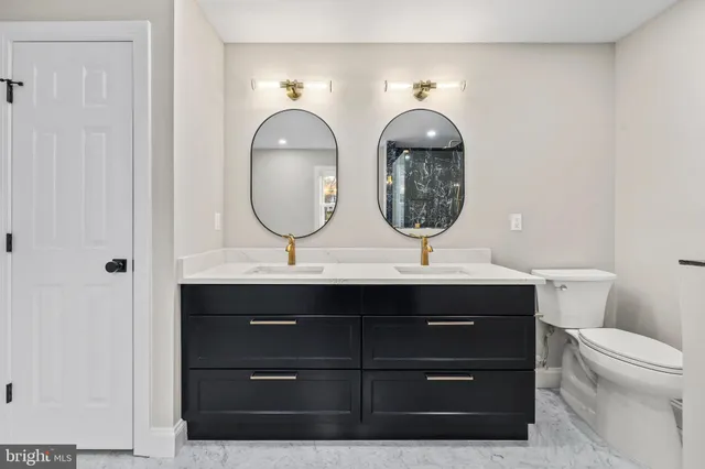 a spacious bathroom with a tub a sink and mirror