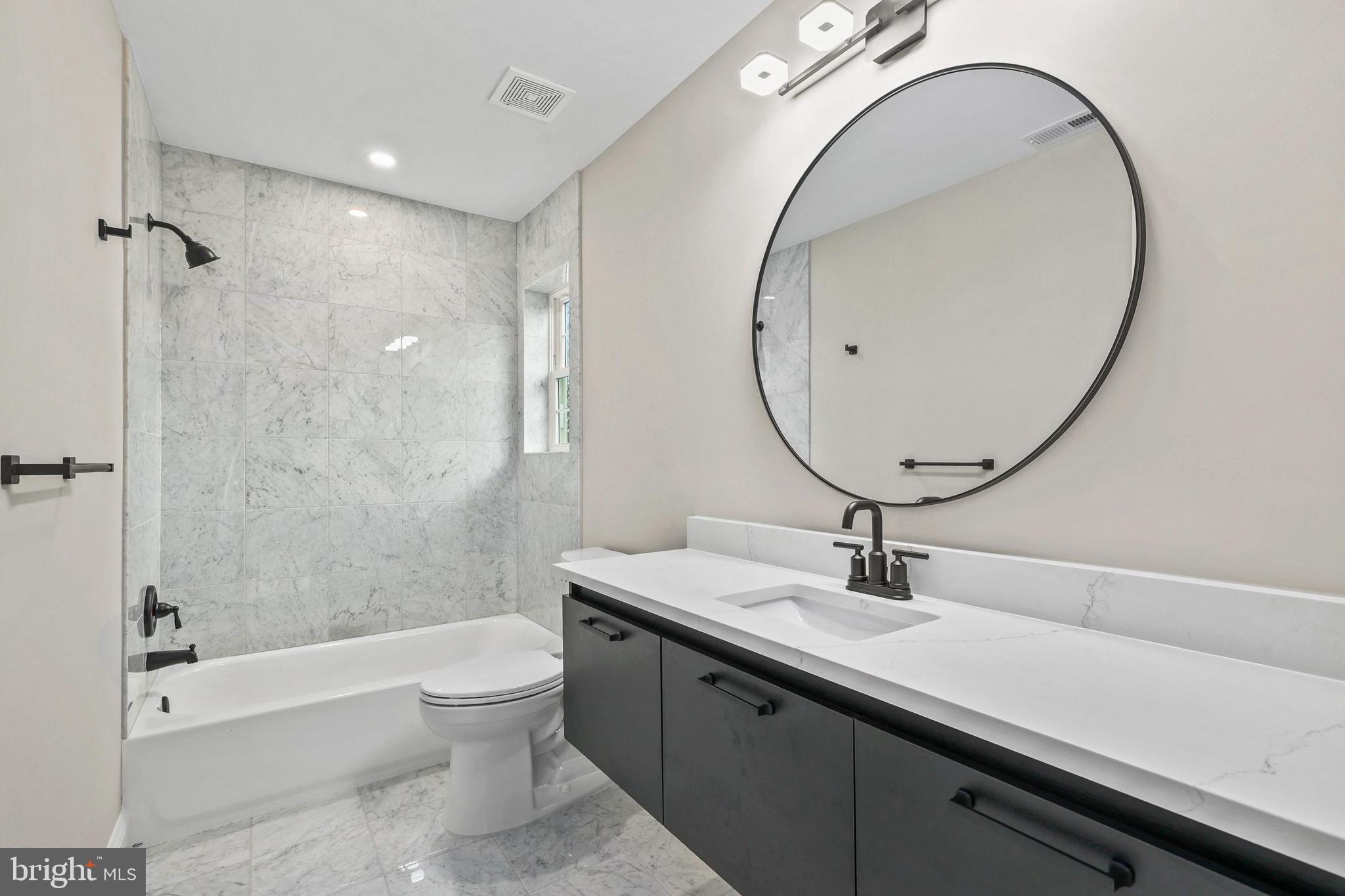5393 Merry Oaks Road The Plains, VA 20198 - Photo 37 of 58 a bathroom with a sink a toilet and a mirror
