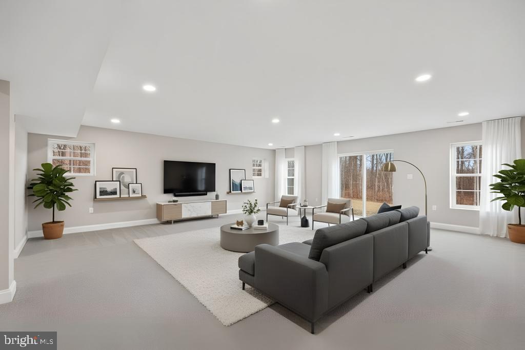 5393 Merry Oaks Road The Plains, VA 20198 - Photo 41 of 58 a living room with furniture and a flat screen tv