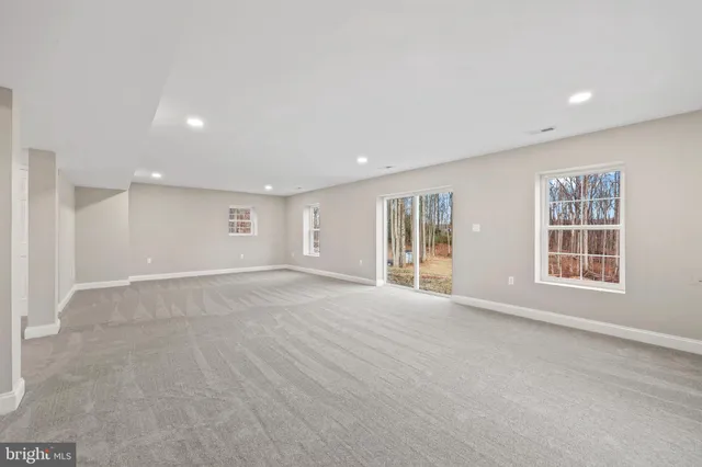 an aerial view of a houses with a lake view