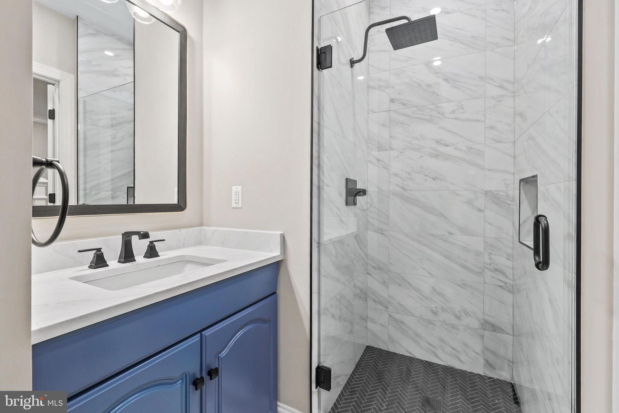 5393 Merry Oaks Road The Plains, VA 20198 - Photo 46 of 58 a bathroom with a sink and a mirror