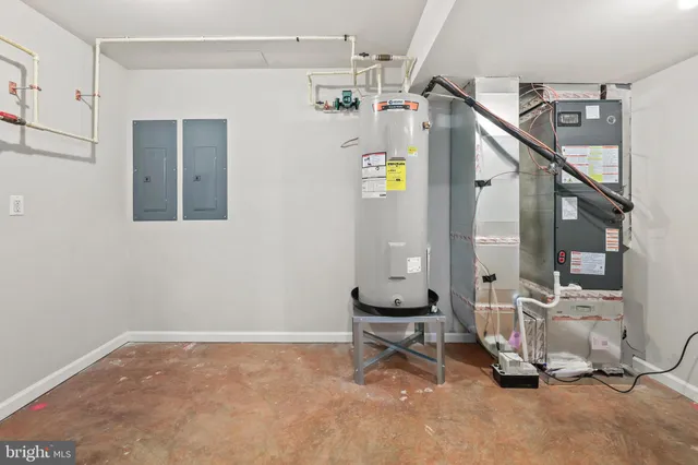 a view of a house with a yard and potted plants