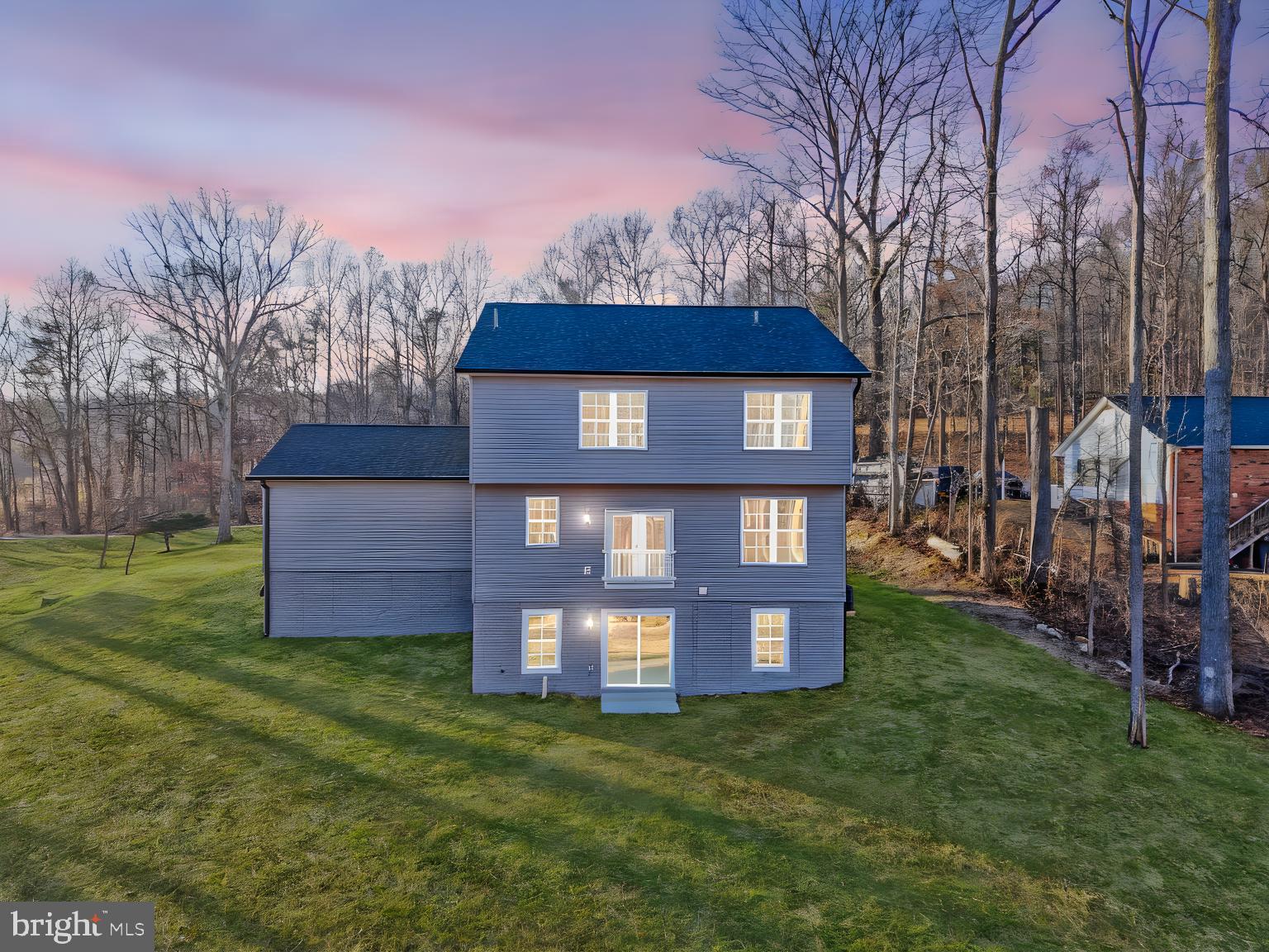 5393 Merry Oaks Road The Plains, VA 20198 - Photo 50 of 58 a tall building with a big yard and large trees